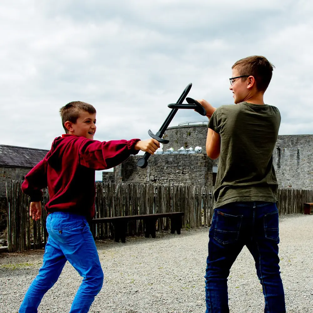 kids enjoying medieval games in The Courtyard