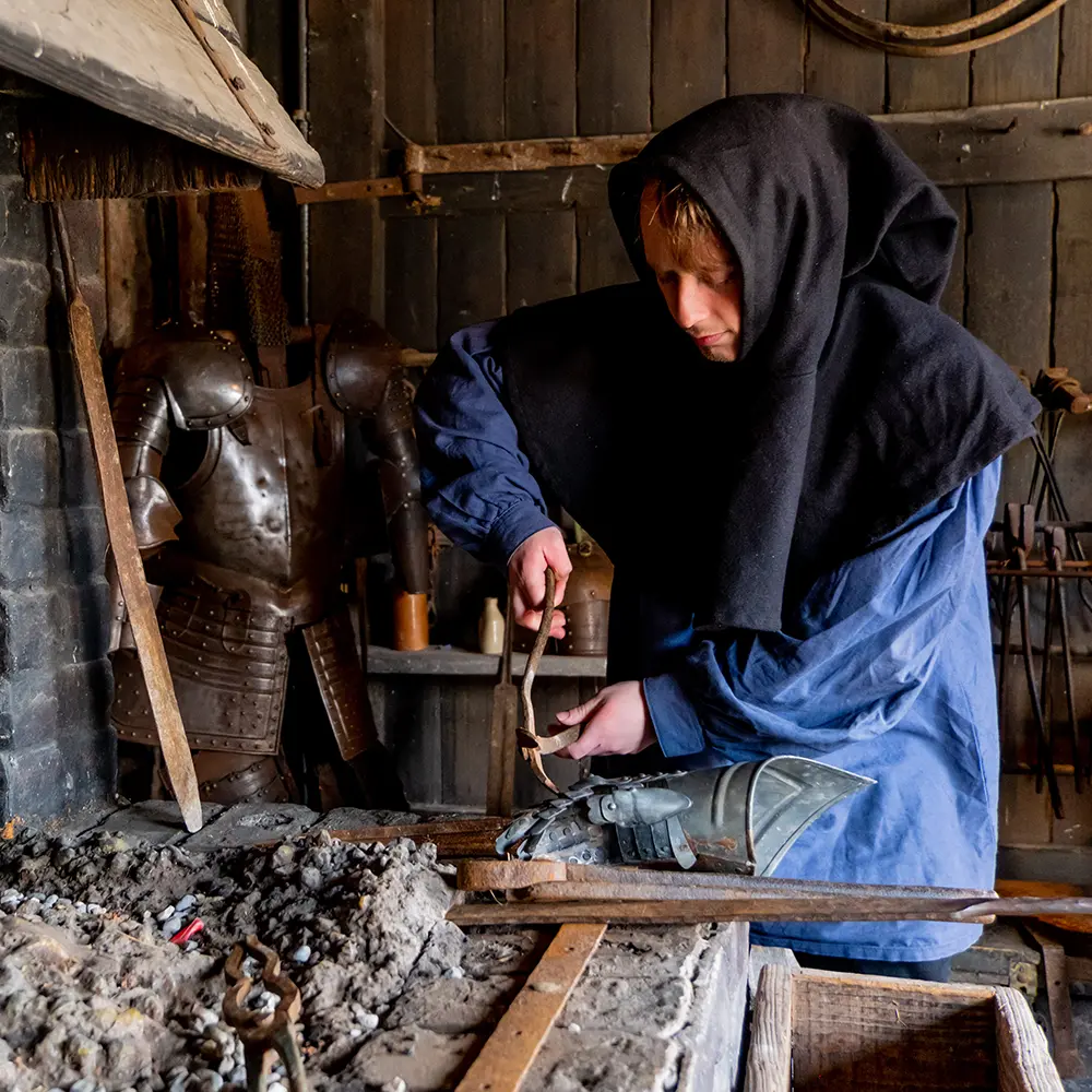 activity - blacksmiths forging tools and weapons